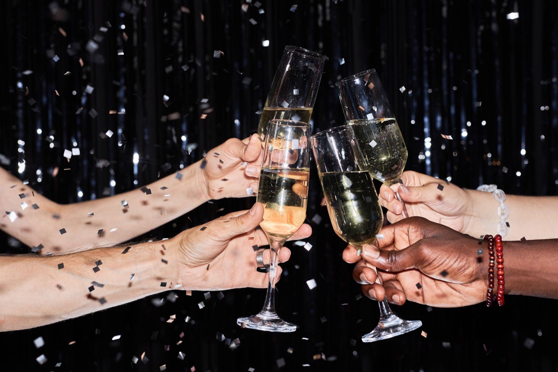 Guests raising champagne glasses in a toast